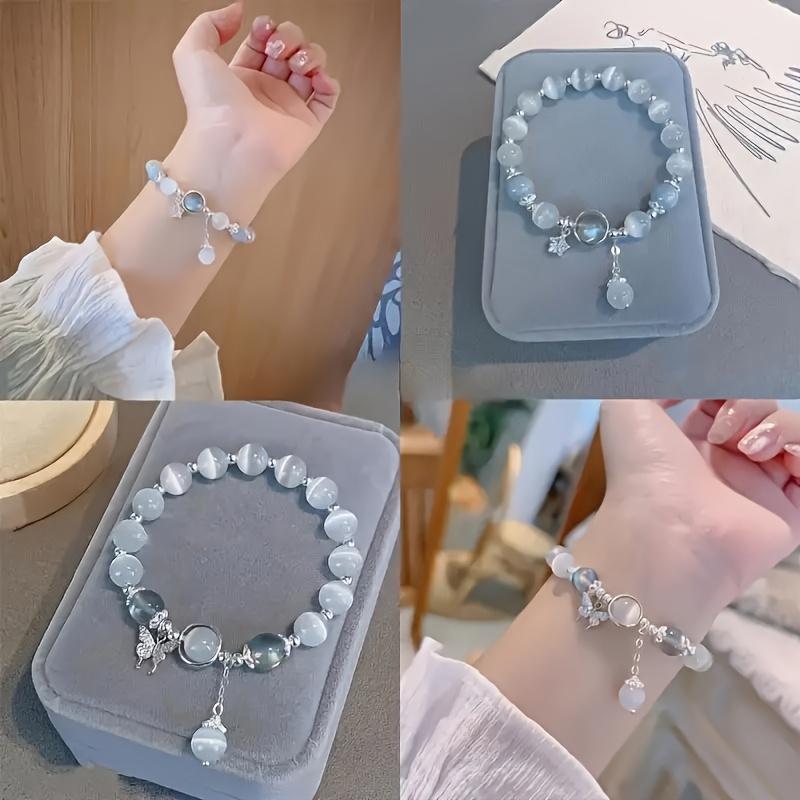 An elegant glass bead bracelet featuring a star pendant-a sophisticated, faux cat's-eye style accessory suitable for women and individuals aged 15 and up. Perfect for Valentine's Day, Carnival, and Christmas parties.