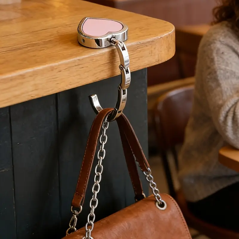 Loveheart leather metal hook, women's bag hook stand, desktop hook bag holder, Purse Hooks, Purse Hanger For Table, available in various colors, suitable for travel, office and leisure use. Made of metal, it is sturdy and durable. Leather style.
