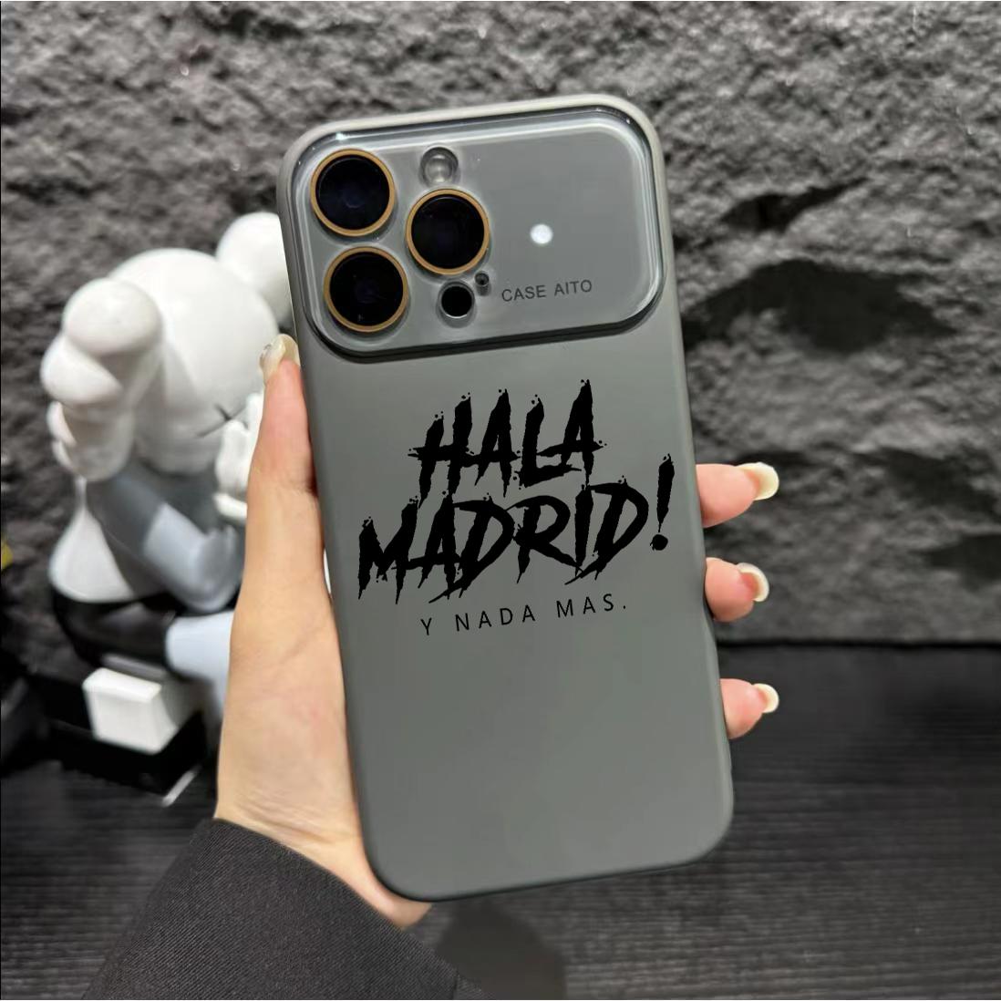 A mobile phone protective case with a HALA Madrid pattern design. It has protection at the camera lens, the case is generally soft, and it has a smooth handfeel. Suitable for iPhone 11, 12, 13, 14, 15, 16, 17 PIUS, Pro, and Promax