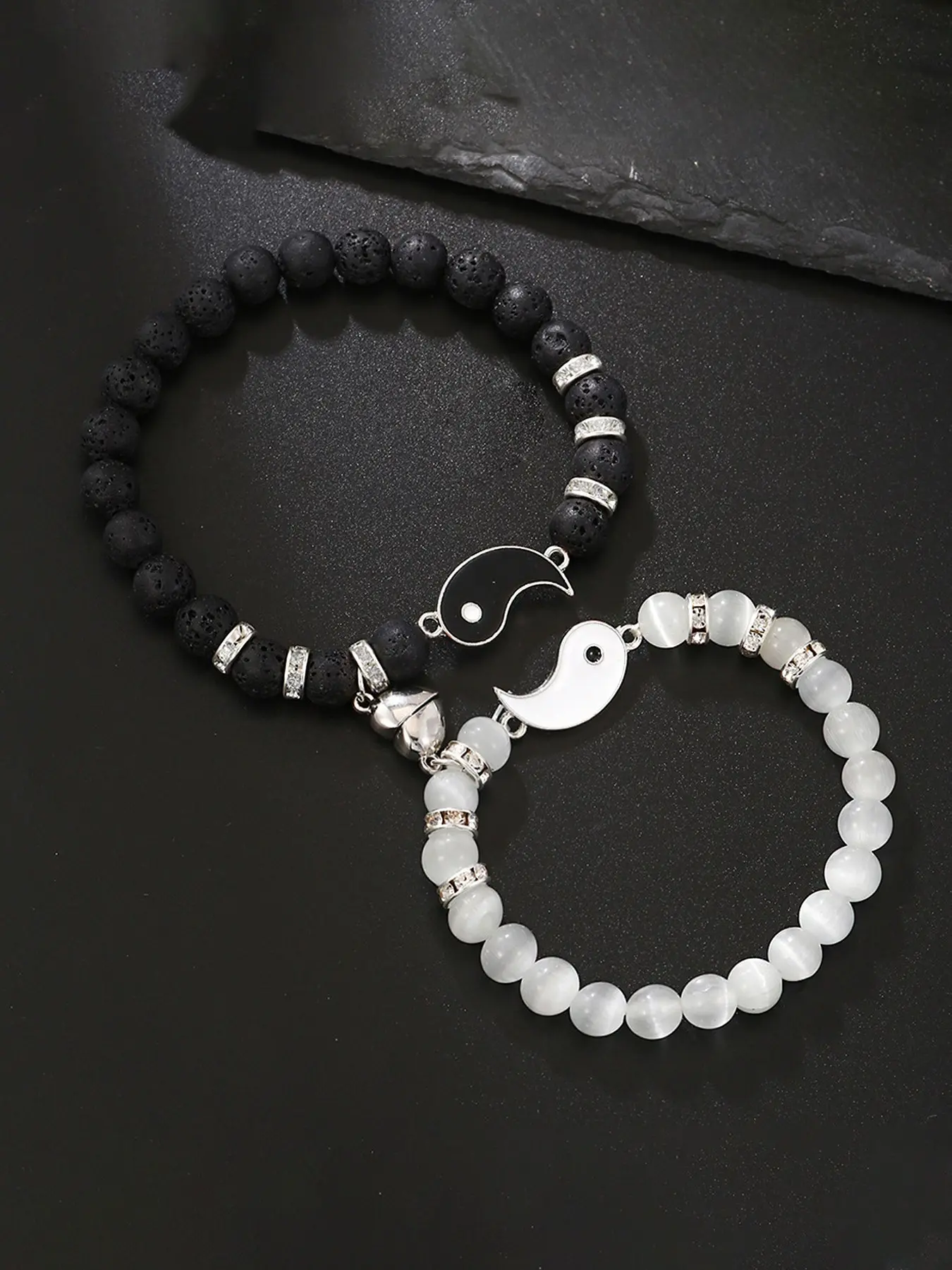 Matching Tai Chi Couple Bracelets, promise jewelry with magnetic split heart, black lava stone & white cat-eye beads. Ideal gift for boyfriend, girlfriend, husband, wife & soulmate, suitable for Valentine’s Day, Christmas, anniversaries and birthdays.