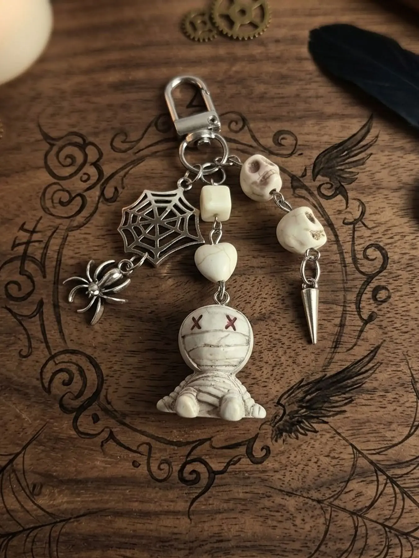 Gothic Spooky Mummy Doll Keychain, Cute Halloween Bag Charm With Silver Spiderweb Spider & White Skull Beads, Heart Bead Cone Spike Pendant, Off‑White Distressed Grunge Aesthetic Purse Ornament, Dark Y2k Backpack Accessory Gift For Goth Emo Girls.