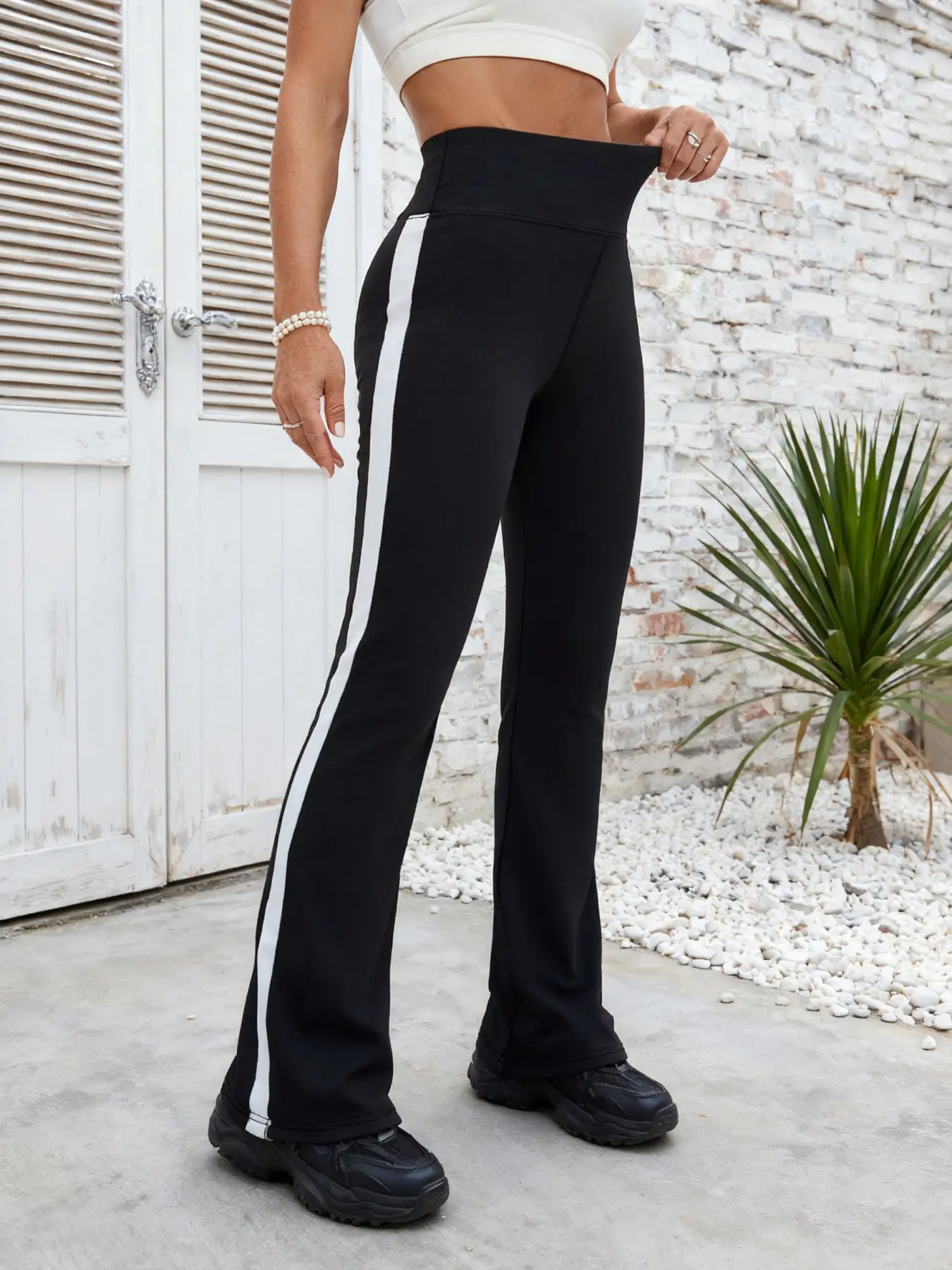 Women's high-waisted slim-fitting micro-harem pants with elastic sides and white stripes, high-waisted flared yoga pants for casual exercise.