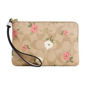 COACH Corner Zip 16 Floral Print Coated Canvas and Leather Clutch Bag for Women in Gold and Light Khaki Chalk Multicolor