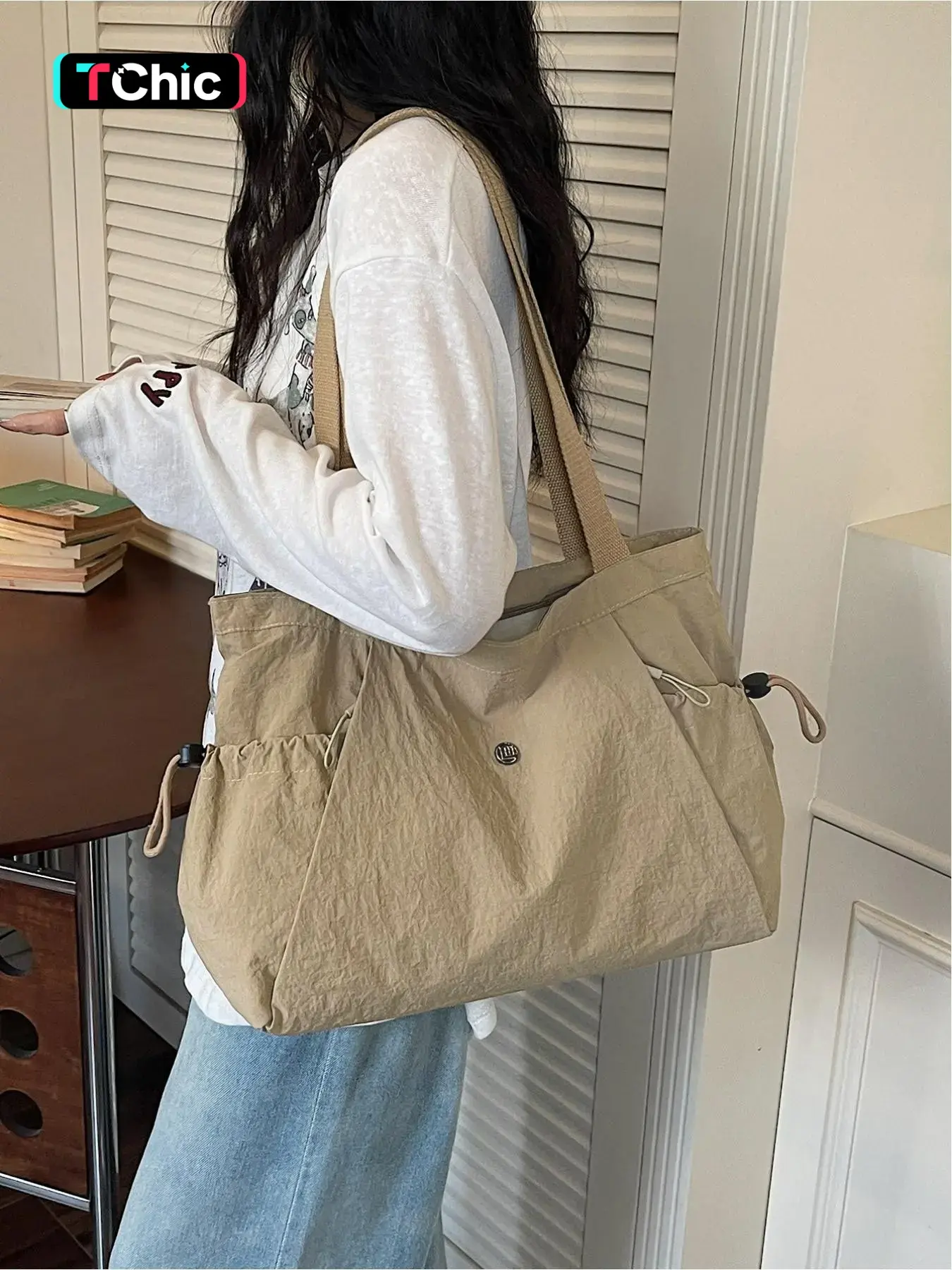 Lazy style drawstring multi pocket large capacity Hobo crossbody fashion bag, Everyday shoulder bag, Relaxed silhouette, adjustable wide shoulder straps, side pockets with drawstring design, can hold computers, books, umbrell