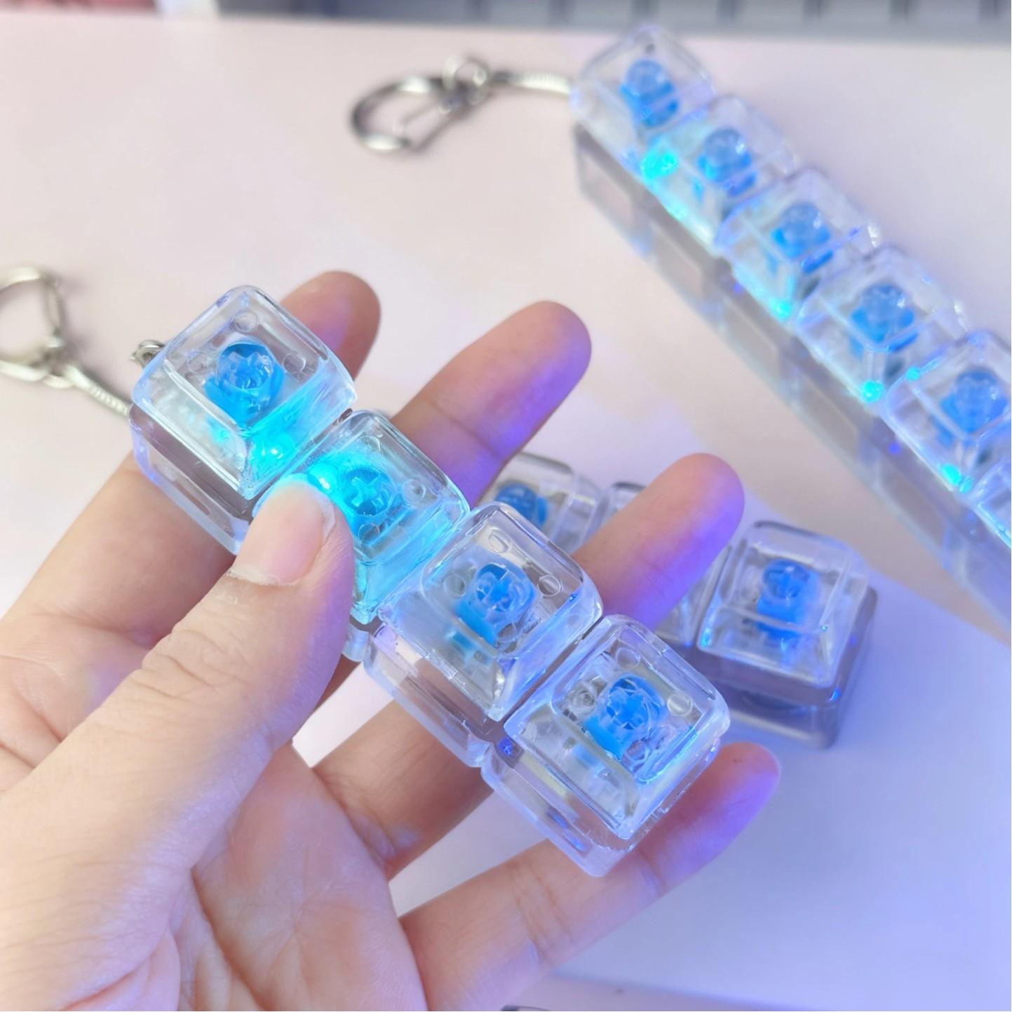 4-key decompression button, Russian Tetris keychain, mechanical key with light-emitting function, stress-reducing fingertip toy key.