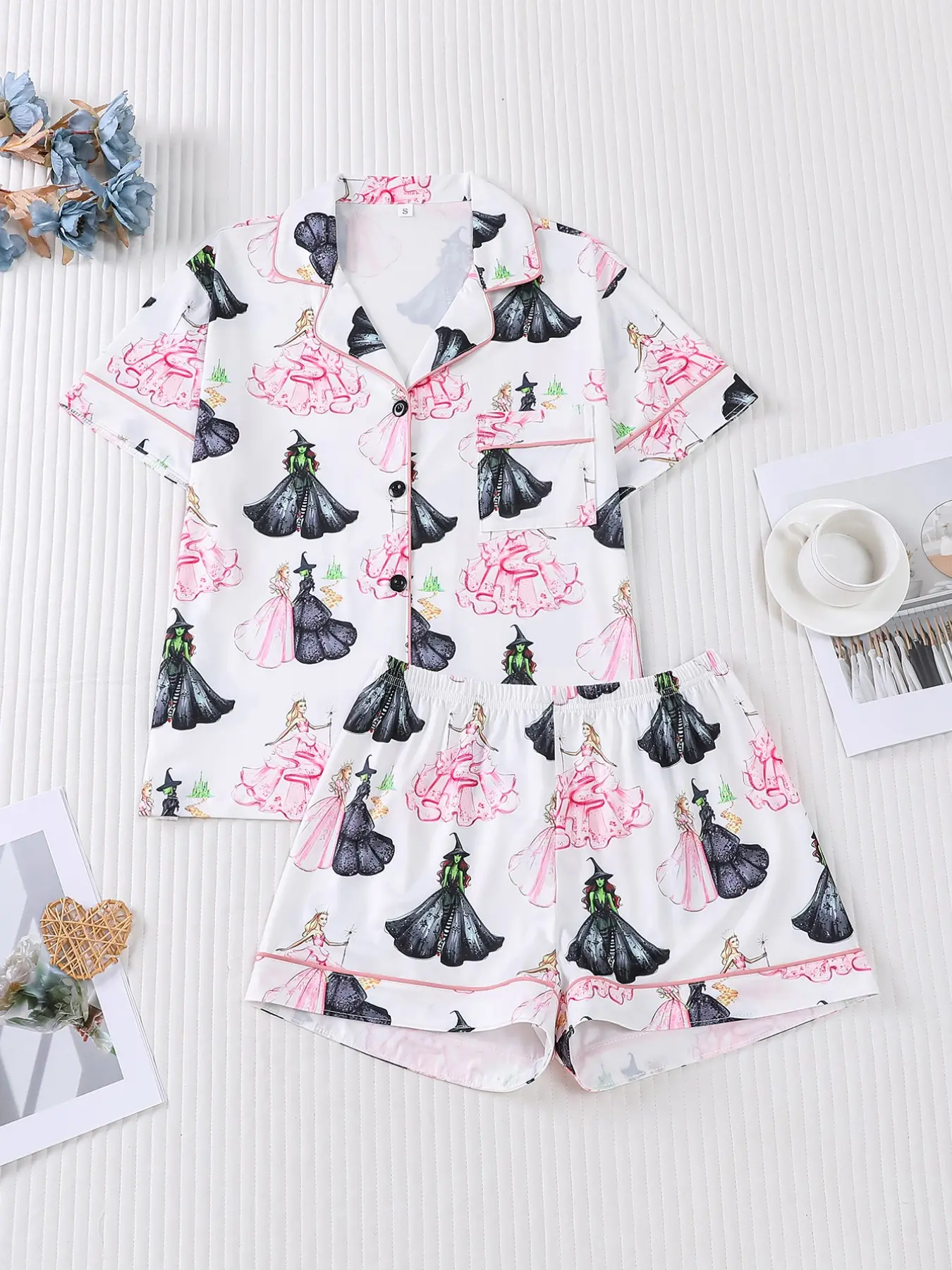 Women's 2-piece Halloween pajama set, Nightwear Pajamas, white base with cute princess & wicked witch print, sweet spooky fantasy vibe, light pink piping trim. Lapel top with pocket, soft elastic shorts, all-season casual women loungewear