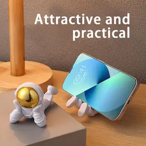 Creative souvenir astronaut figurine for living room decoration, birthday gift, desktop phone holder, small gift
