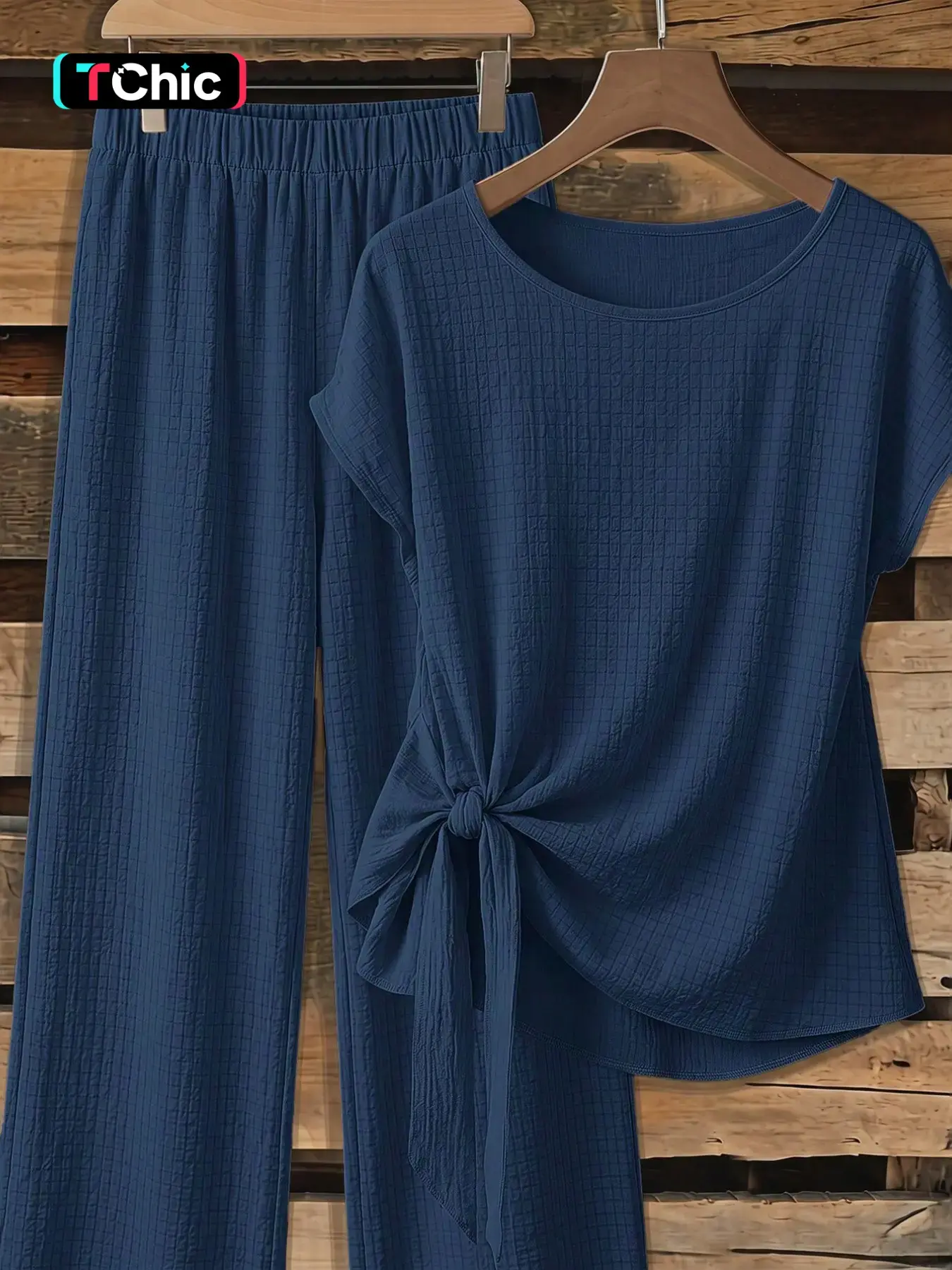 Women's casual solid color bow tie short shirt and loose straight-leg trousers two-piece set, suitable for spring and summer wear.