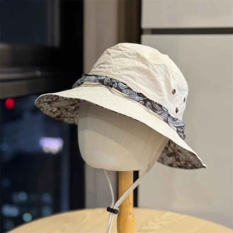 Stay stylishly shaded with this vintage paisley bucket hat. Featuring a beautiful patterned brim and adjustable windproof drawstring. Lightweight foldable and waterproof for your hiking camping or festival trips. Upgrade your outdoor style now. Tap below.