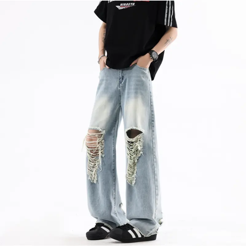 Men’s Blue Washed Denim Wide Leg Pants Distressed Large Knee Rip Frayed Detail Raw Edge Hem Fashion Street Jeans Ideal For Casual And Hip Hop Style