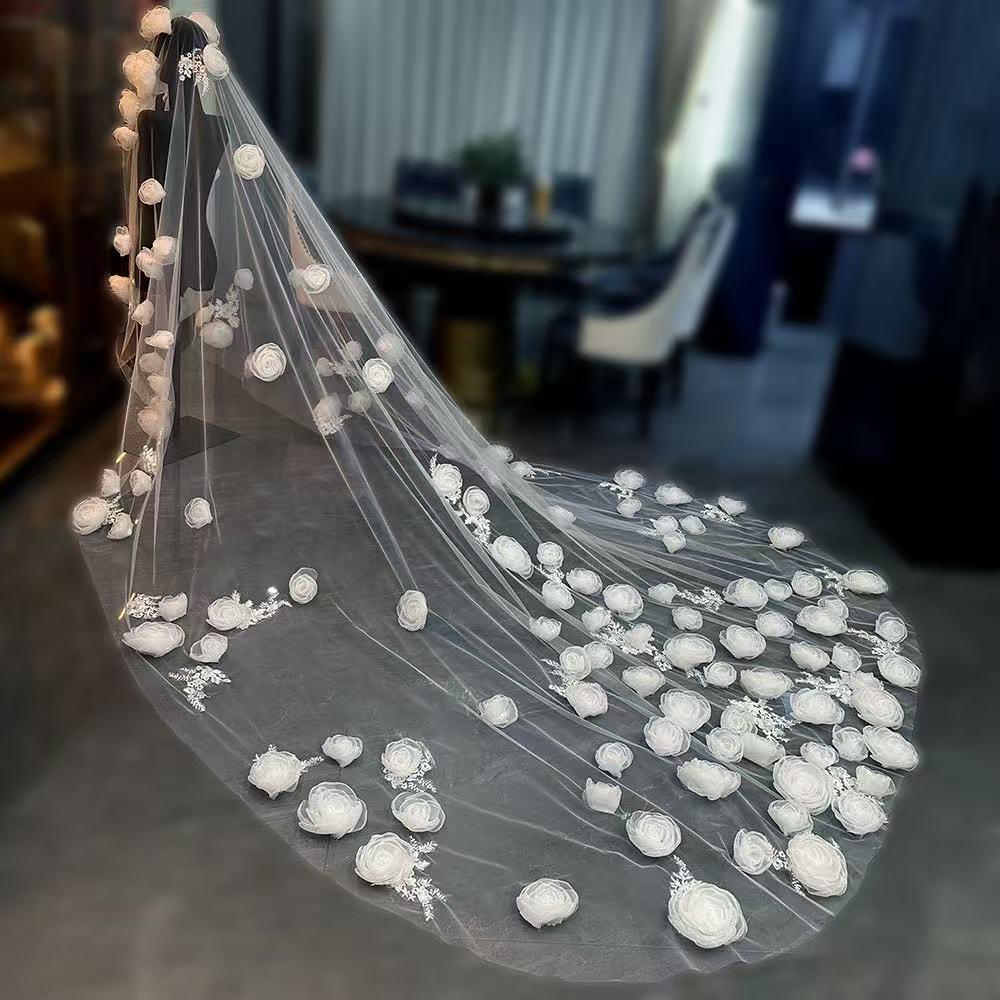 Luxury-style long veil with dreamy, elaborate floral designs and a cathedral-style train