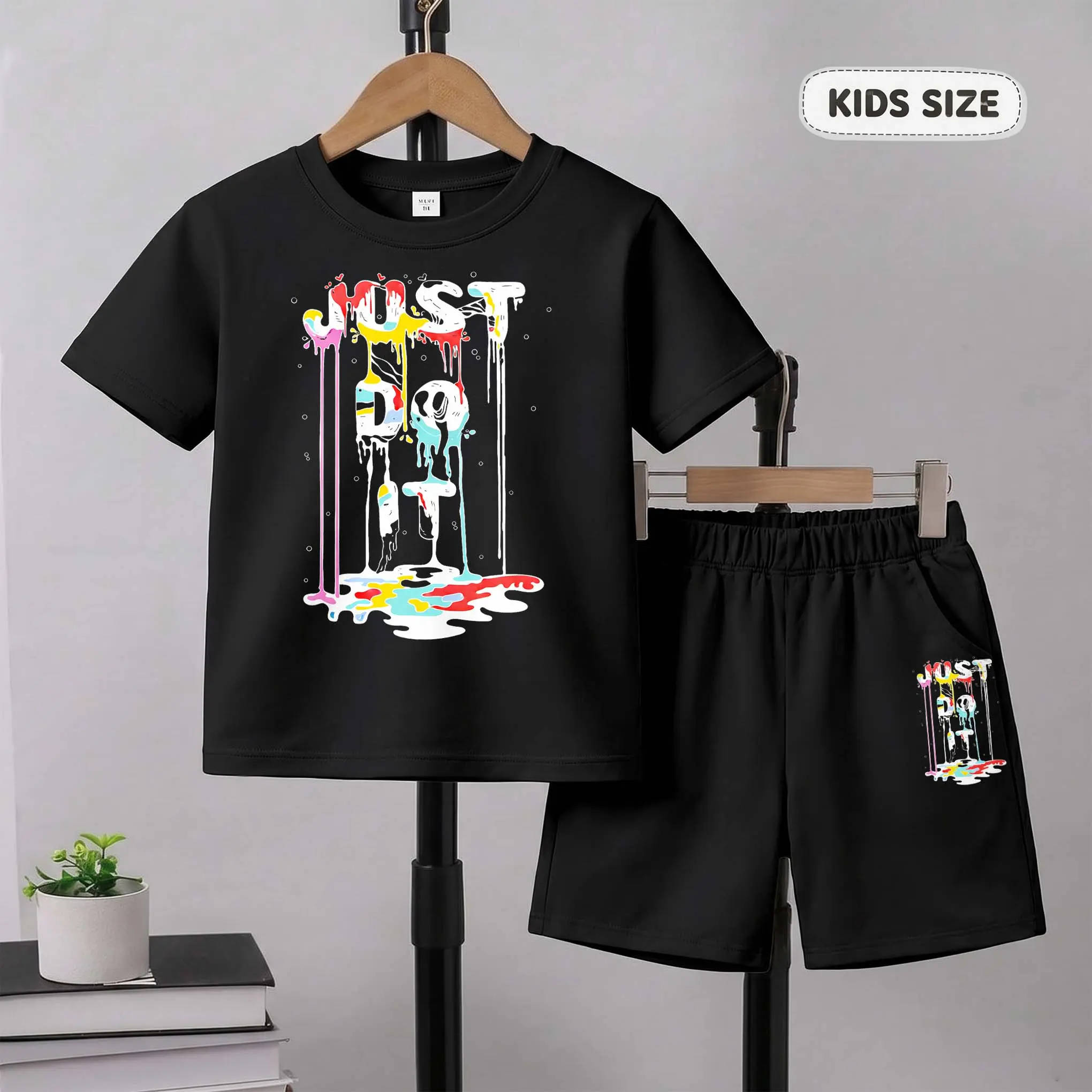 Kids’ Ink-Wash Style Text Cartoon Print Short-Sleeve T-Shirt And Shorts Set—Casual Summer Kids' Clothing. This Round-Neck Outfit Combination Is Perfect For Everyday Wear And Outdoor Play.