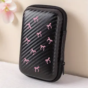This hollowed out bow patterned EVA storage box is suitable for both work and travel! This earphone, data cable, and charger storage case features a compact design with grid pockets for easy organization of charging cables.