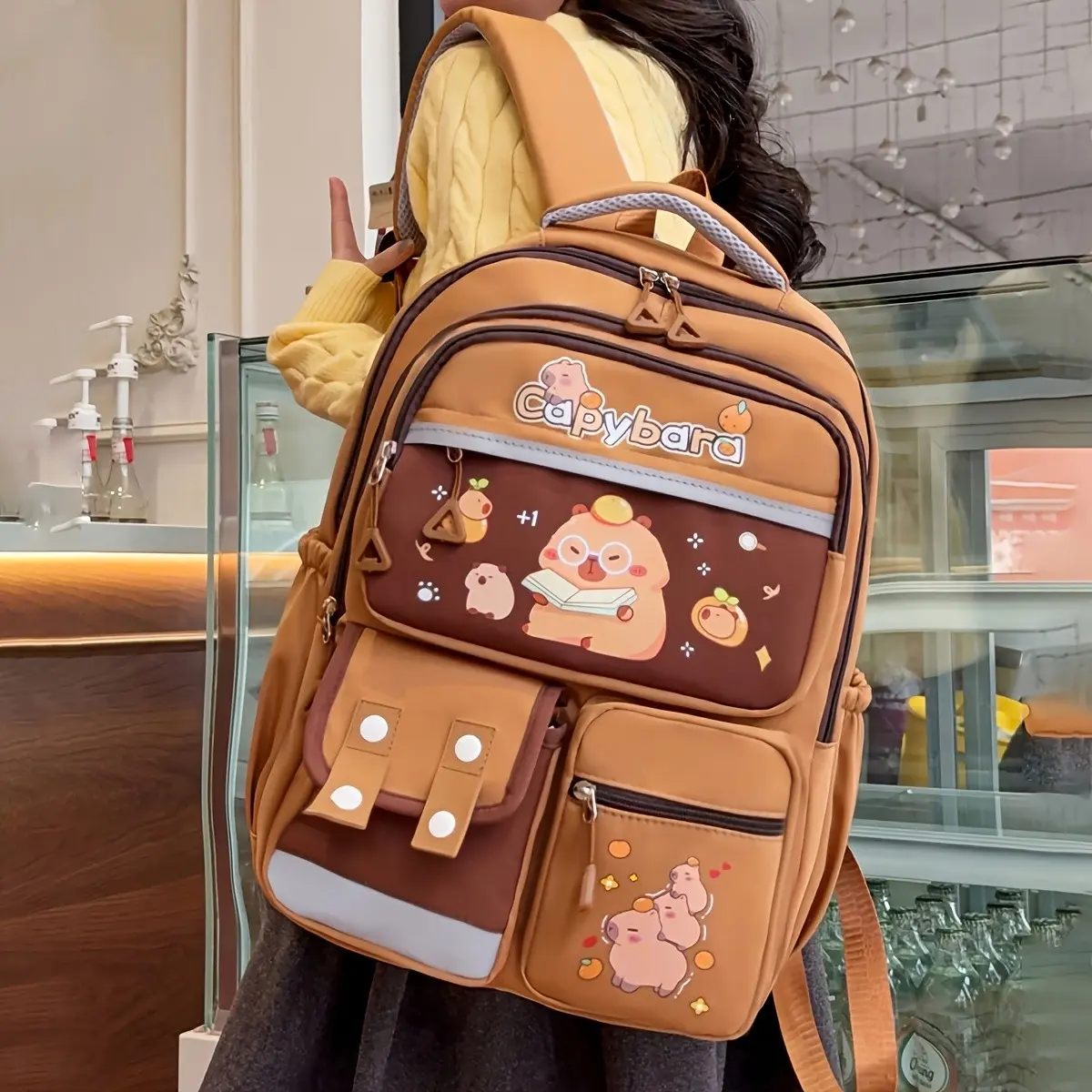 A Backpack Featuring a Cute Enormous Capybara Design with Contrasting Colors, Ideal for Ample Storage, It's a Student Bag Equipped with Several Pockets, Making It a Stylish And Functional School Bag Lightweight Cute Backpacks School