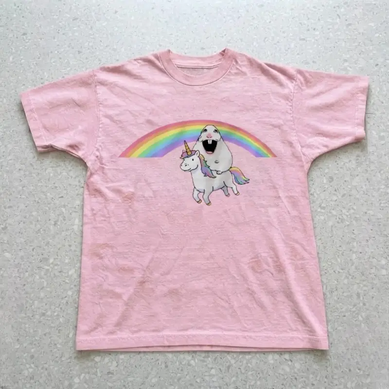 cute tee with graphic of a unicorn with a hamster above it