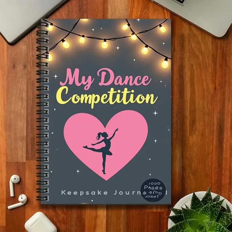 A spiral-bound notebook commemorating a dance competition, with a cover featuring colorful lights, hearts, and dancer patterns, and the eye-catching phrase "My Dance Competition." With a large capacity of 1000 pages, it is suitable for work and study reco