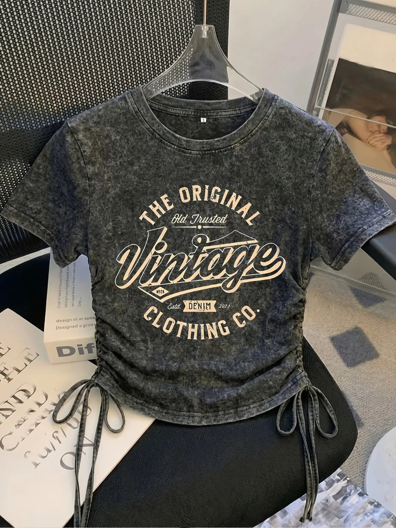 Y2K-style graphic drawstring cropped Women's Round Neck Casual T-shirt; soft, washed cotton fabric; versatile streetwear top perfect for café-hopping and "hot girl" aesthetic photos.