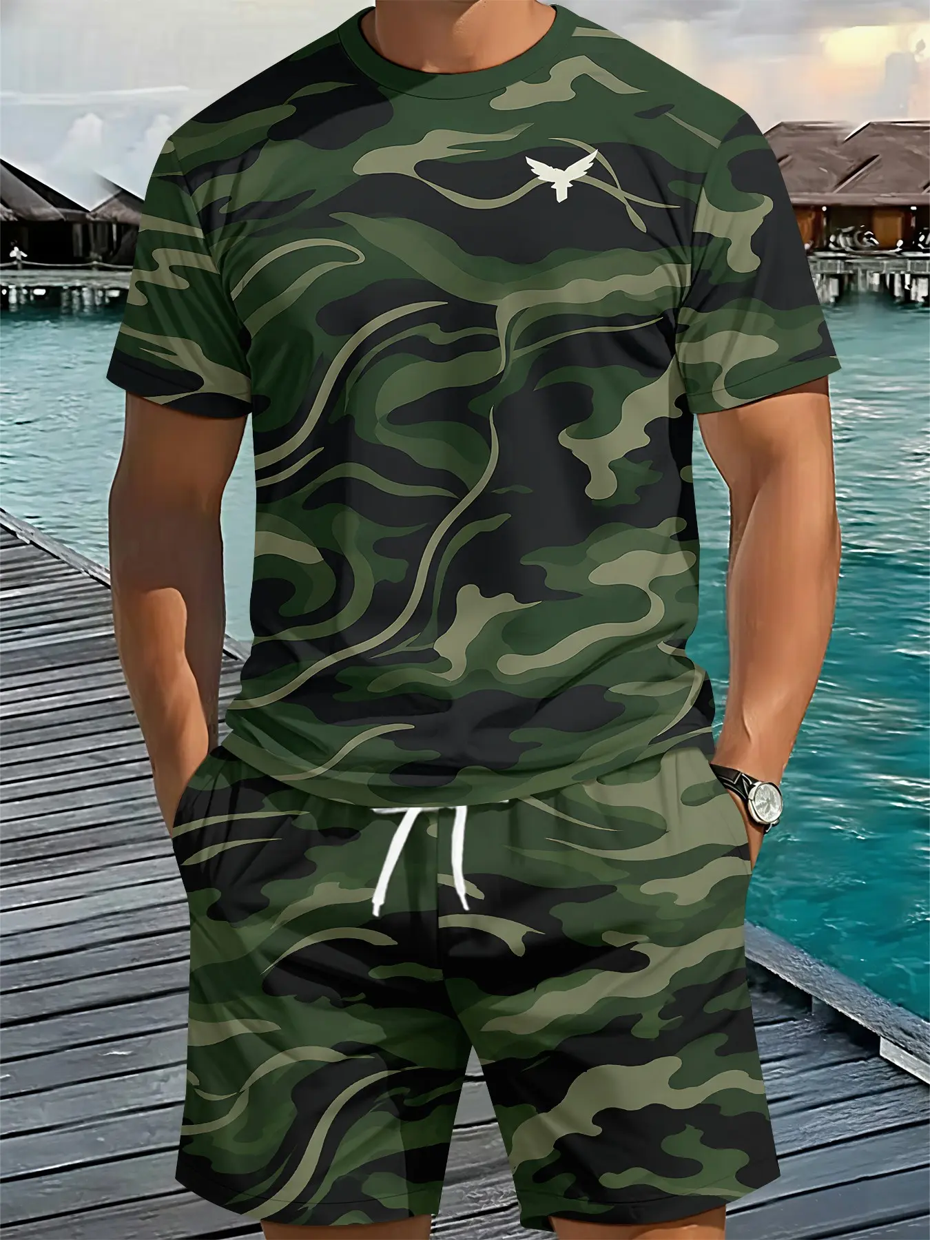 Men's two-piece set of short-sleeve top and shorts, dark green flowing camouflage with small printed bird logo, outdoor functional men's suit with 3D digital printing, comfortable, loose and breathable sports casual wear, trendy, minimalist, stylish and v