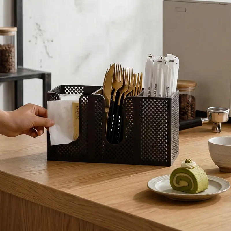 Disposable paper cup holder, suitable for coffee stations, can be wall-mounted or placed on a countertop, with 3 compartments to hold paper cups, lids, and stirrers  a kitchen coffee bar storage rack with a mesh design.
