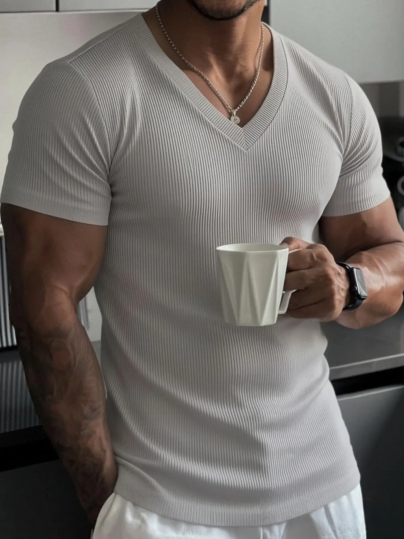 Men's vertical slit V-neck short-sleeved, fitted and elasticated, showing muscles, a basic casual style. Soft and breathable, simple and elegant solid-color T-shirt. Suitable for outdoor sports and daily leisure wear.