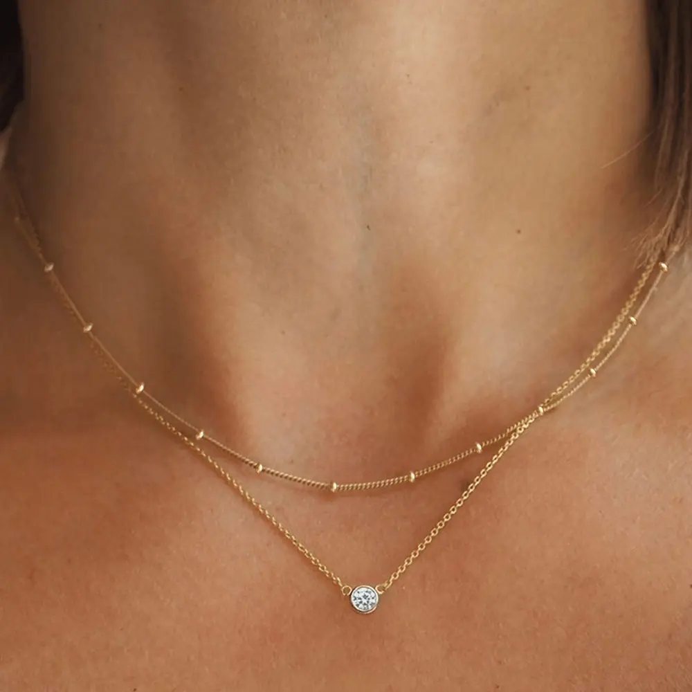 Exquisite double-layer stainless steel necklace featuring a single-stone pendant; an elegant, affordable luxury piece with a unique, high-end aesthetic-perfect for layering or wearing with the accompanying beaded chain.