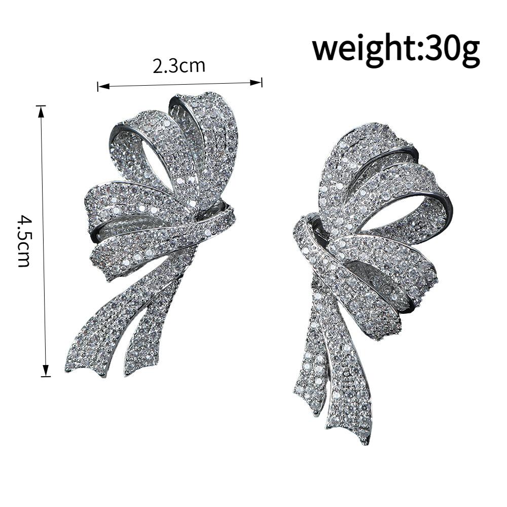 Three-dimensional bow earrings, full of diamonds, dazzling and sweet, light luxury, ultra-shiny, diamond-studded, high-end earrings with exquisite elegance. birthday gifts for gf