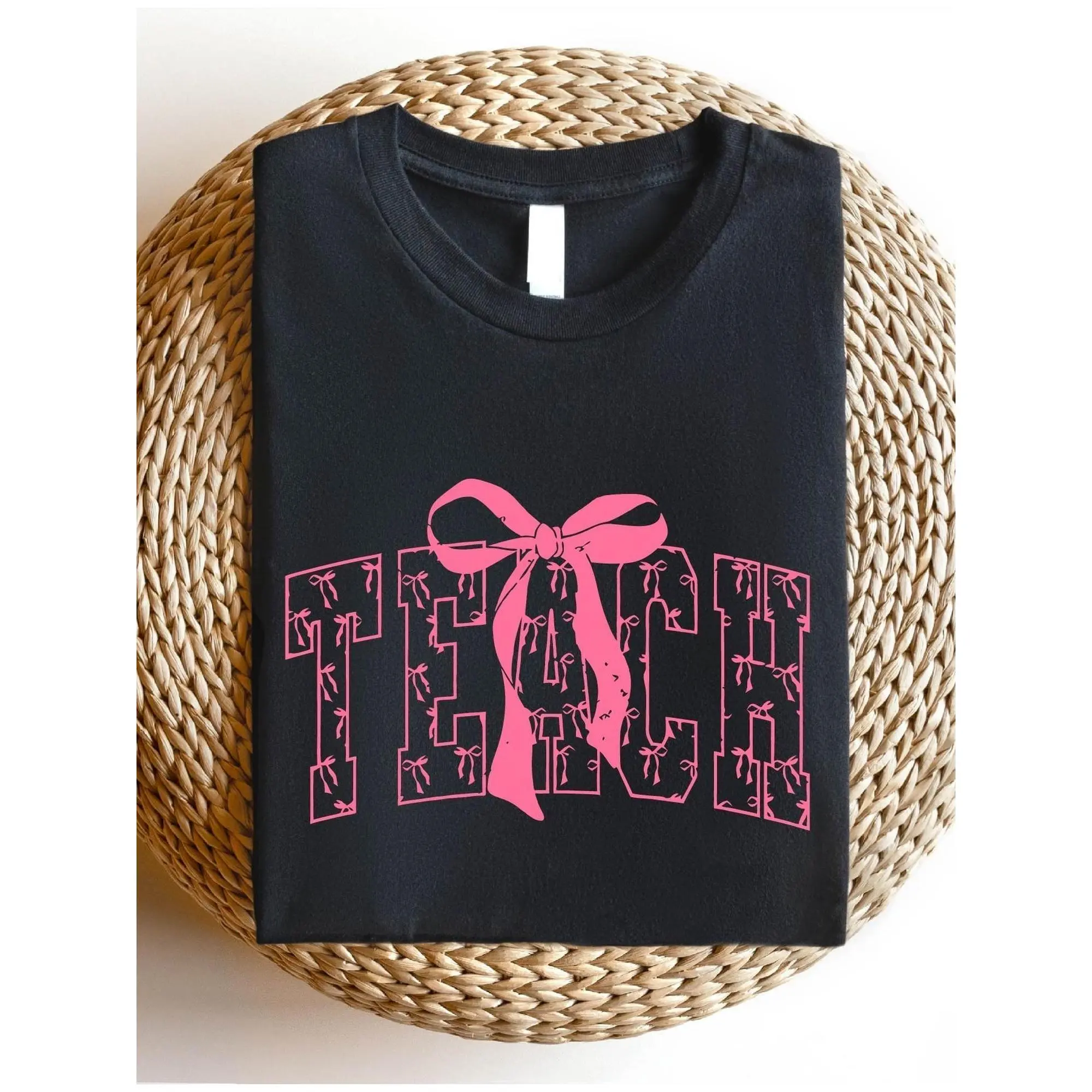 Coquette Pink Bow "TEACH" Graphic T-Shirt - Soft Teacher Appreciation Tee for Women, Casual Round Neck Short Sleeve Shirt with Camouflage Print, Perfect Gift for Educators, Casual Wear |   Educational Apparel |   Shirt, Teacher Shirts