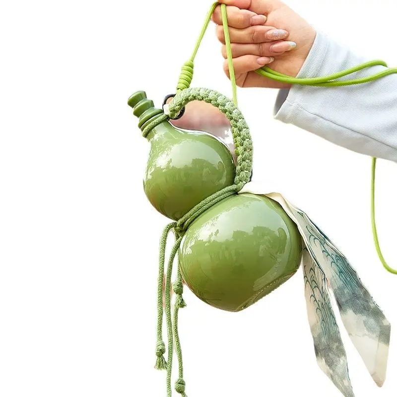 A 500ml ceramic-style glass gourd bottle, perfect for use as a water bottle, wine bottle, beverage bottle, or whiskey bottle, and an ideal gift choice vrial product