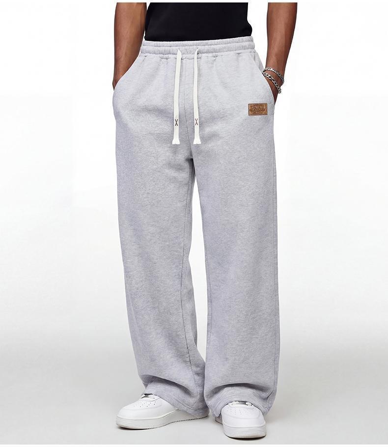 Black loose men’s sweatpants, extremely comfortable for everyday wear, skin-friendly men’s joggers, super comfortable with an elastic waistband, classic drawstring men’s casual sweatpants, suitable for various occasions, and perfect for wearing in spring