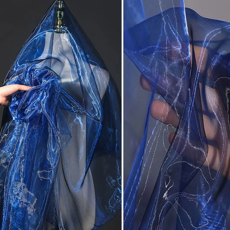 Navy blue two-tone shimmering sheer fabric, lightweight breathable mesh material, suitable for DIY crafts, apparel, and wedding decoration fabrics
