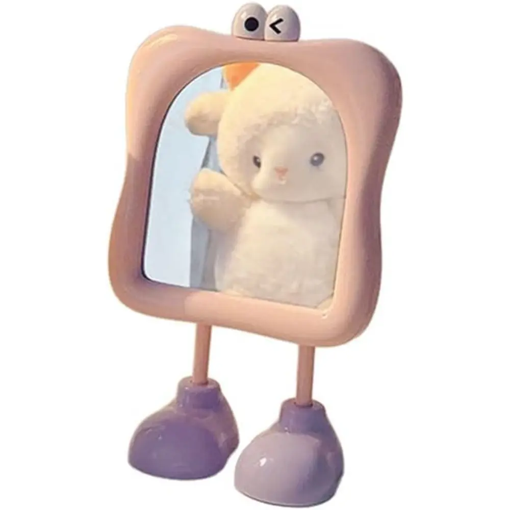 Cute ins-style bigfoot vanity mirror with cartoon eyes and stand, 180° adjustable tilt design. Compact lightweight for bedroom dressers and travel, adorable aesthetic makeup mirror for women’s daily skincare and touch-ups.