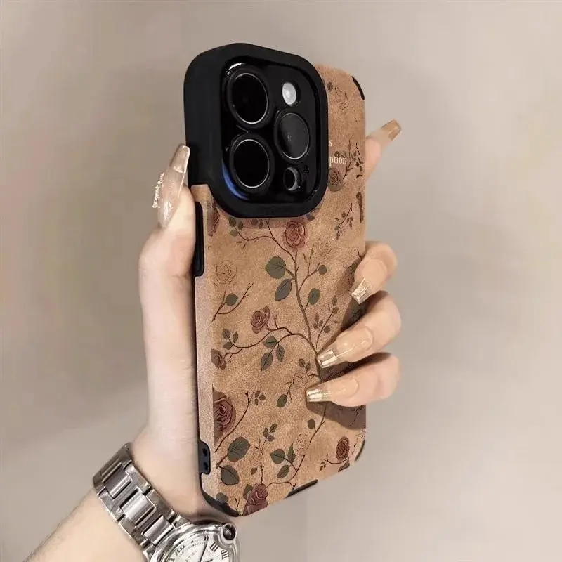 Covered with Yezishan camellia pattern fashion lens, all inclusive protective imitation leather phone case, suitable for iPhone 17, 16, 15, 14, 13, 12, 11 Pro Max Plus Air anti drop military grade protective phone case