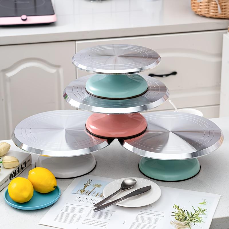 A 10-Inch Cake Turntable And Decoration Table in White And Pink, Designed for Home Baking, Featuring Rotating Tools for Cake Decorating