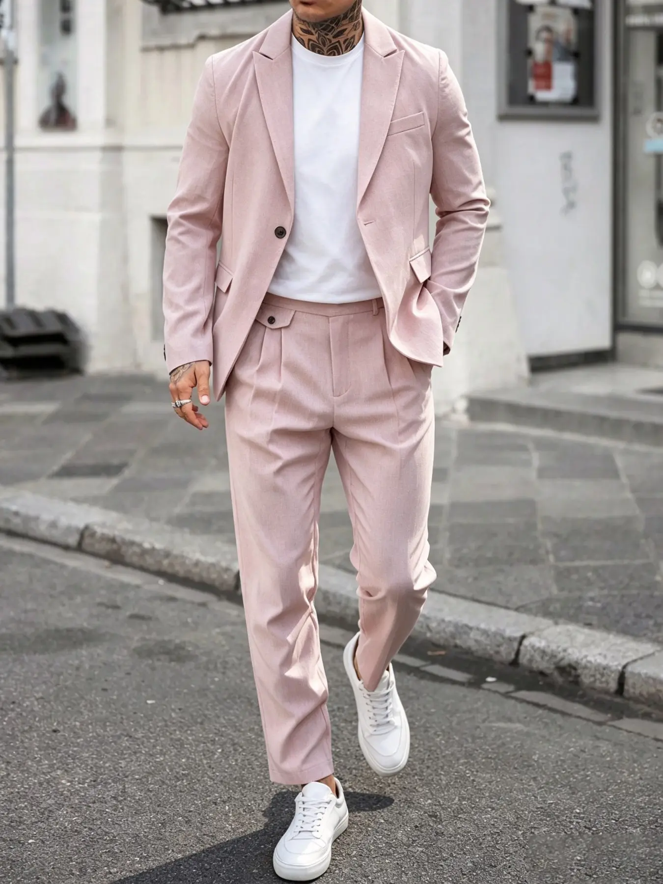 A stylish, casual pink suit set for men; the relaxed fit flatters all body types, while the design features minimalist yet interesting details—a high-quality, trendy ensemble.