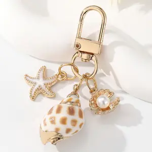 1pc Asymmetrical Shell Starfish & Sea Snail Keychain Pendant, Stylish Ocean Themed Jewelry, Unique Nautical Accessory For Decorating Keys, Purses And Daily Bags