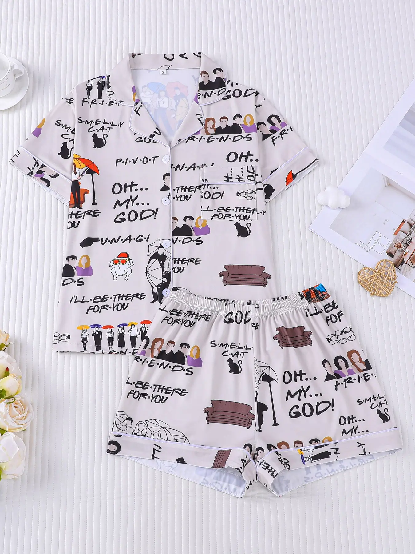 Women's 2-piece pajama set nightwear, light apricot base printed with Friends classic characters, quotes and sofa cartoons. American retro TV show style, white piping lapel top with pocket, elastic waist shorts, soft all-season casual women loungewear