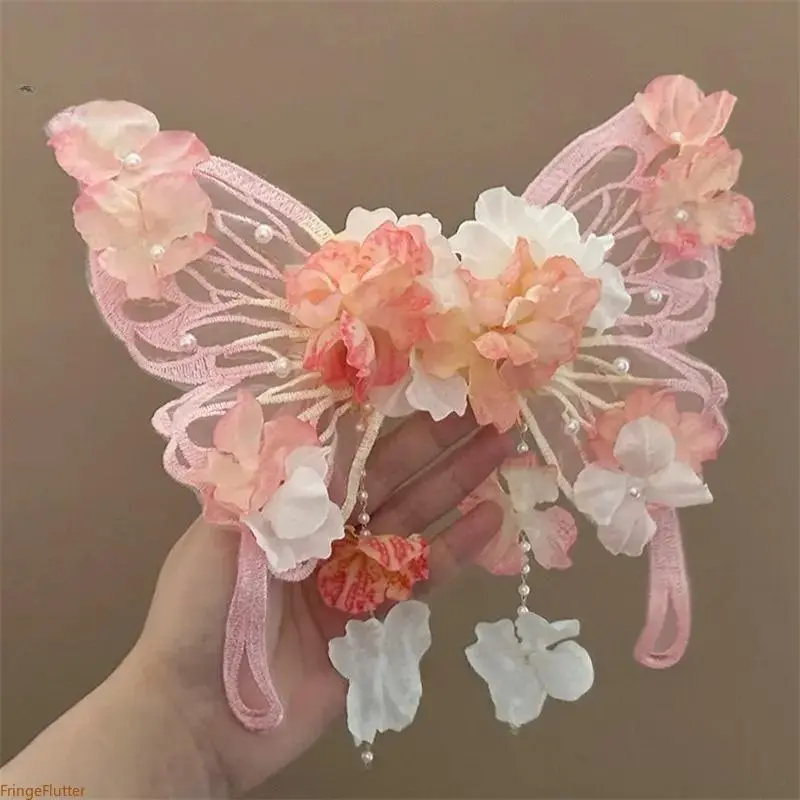 New for Summer 2026: A dreamy blue, fairy-style butterfly hair clip featuring exquisite silk flowers, lace accents, and dangling tassels. This sweet, princess-style accessory is eye-catching and lively—perfect for Hanfu ensembles and party looks.