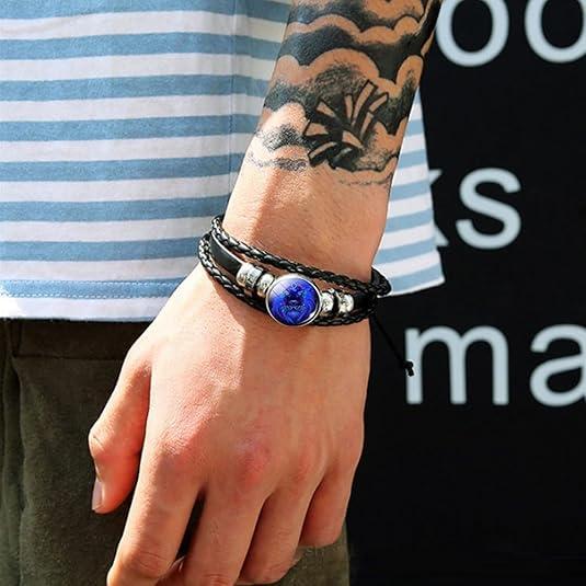Zodiac Energy Bracelet - A black leather wrap bracelet featuring a glow-in-the-dark design that radiates positive energy.