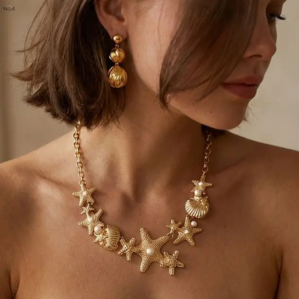 Women's Coastal Bib Necklace with Gold-Tone Starfish & Shell Cluster, Adjustable Faux Pearl Statement Jewelry for Summer Beach Trips