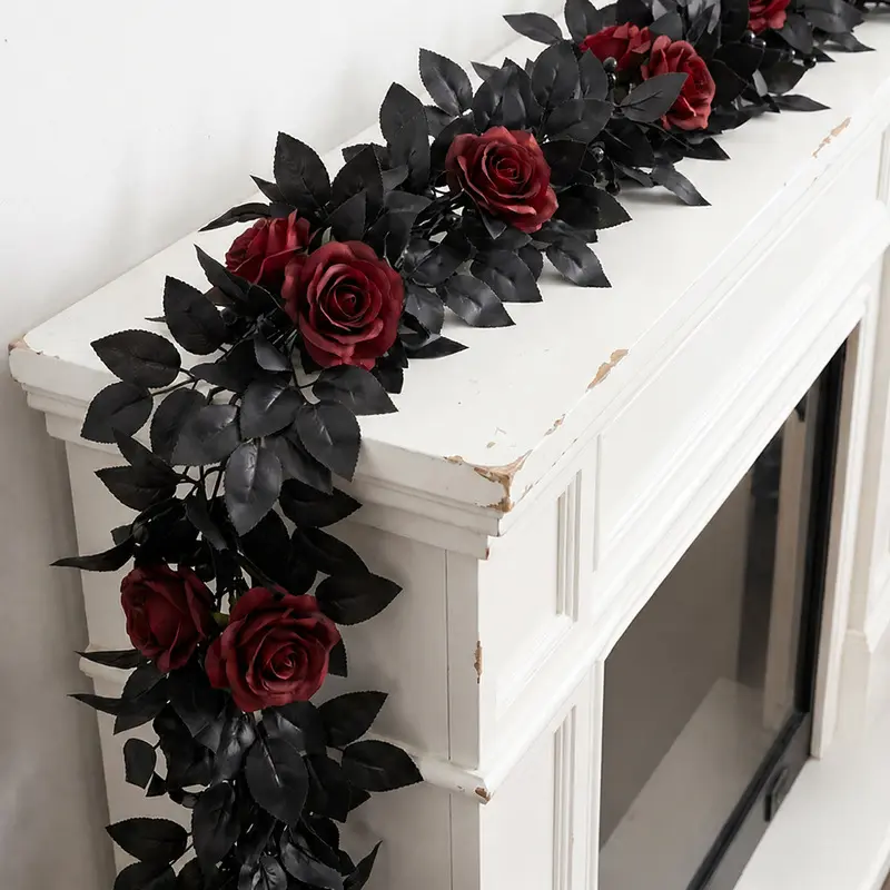 Halloween wedding decoration features black rose vines, artificial black rose leaf vines for indoor and outdoor archway floral arrangements.