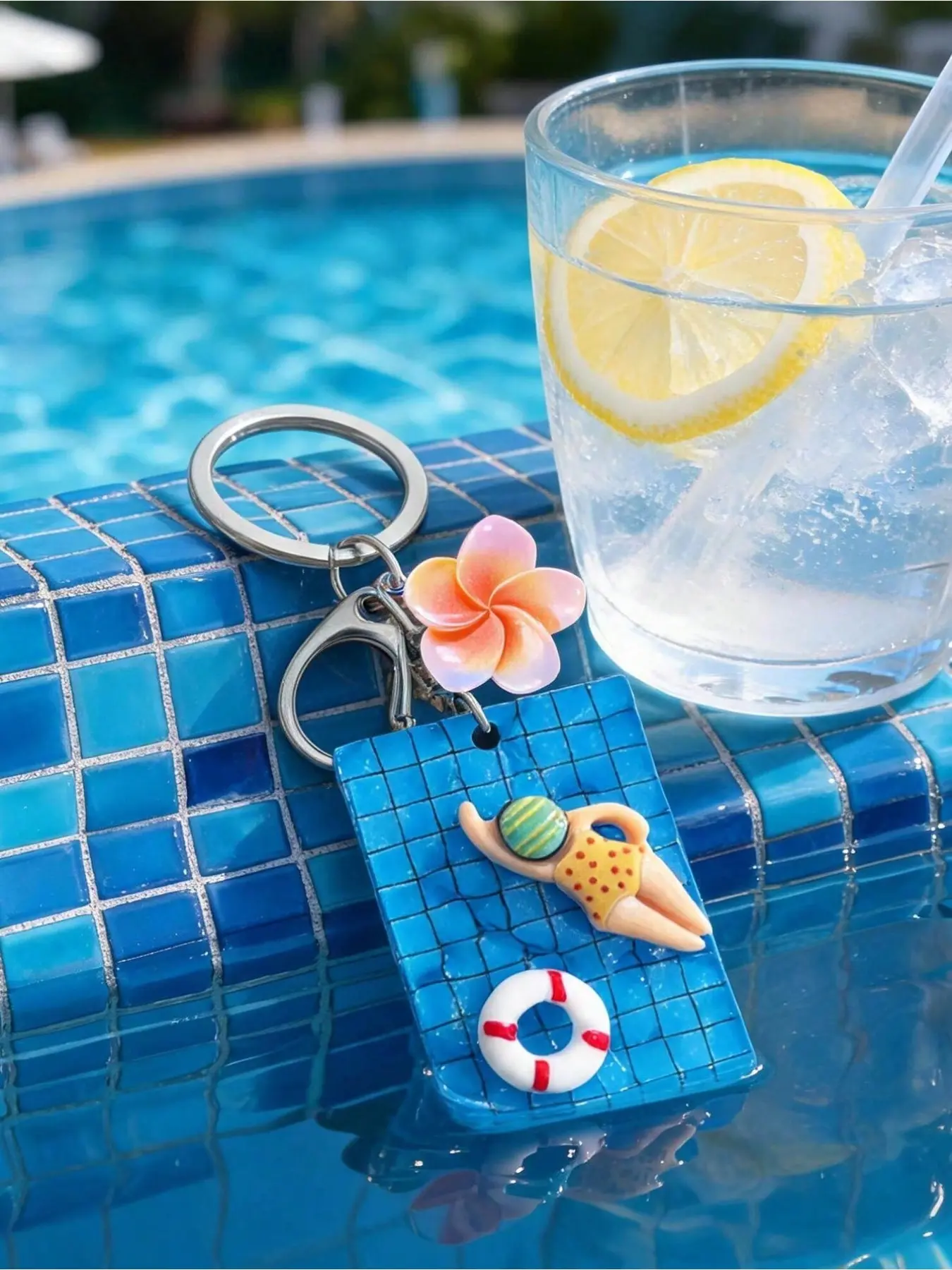 Handmade resin surfboard keychain with swimmer, plumeria and lifebuoy charms. Hawaiian beach style, ideal ornament and gift for various occasions.