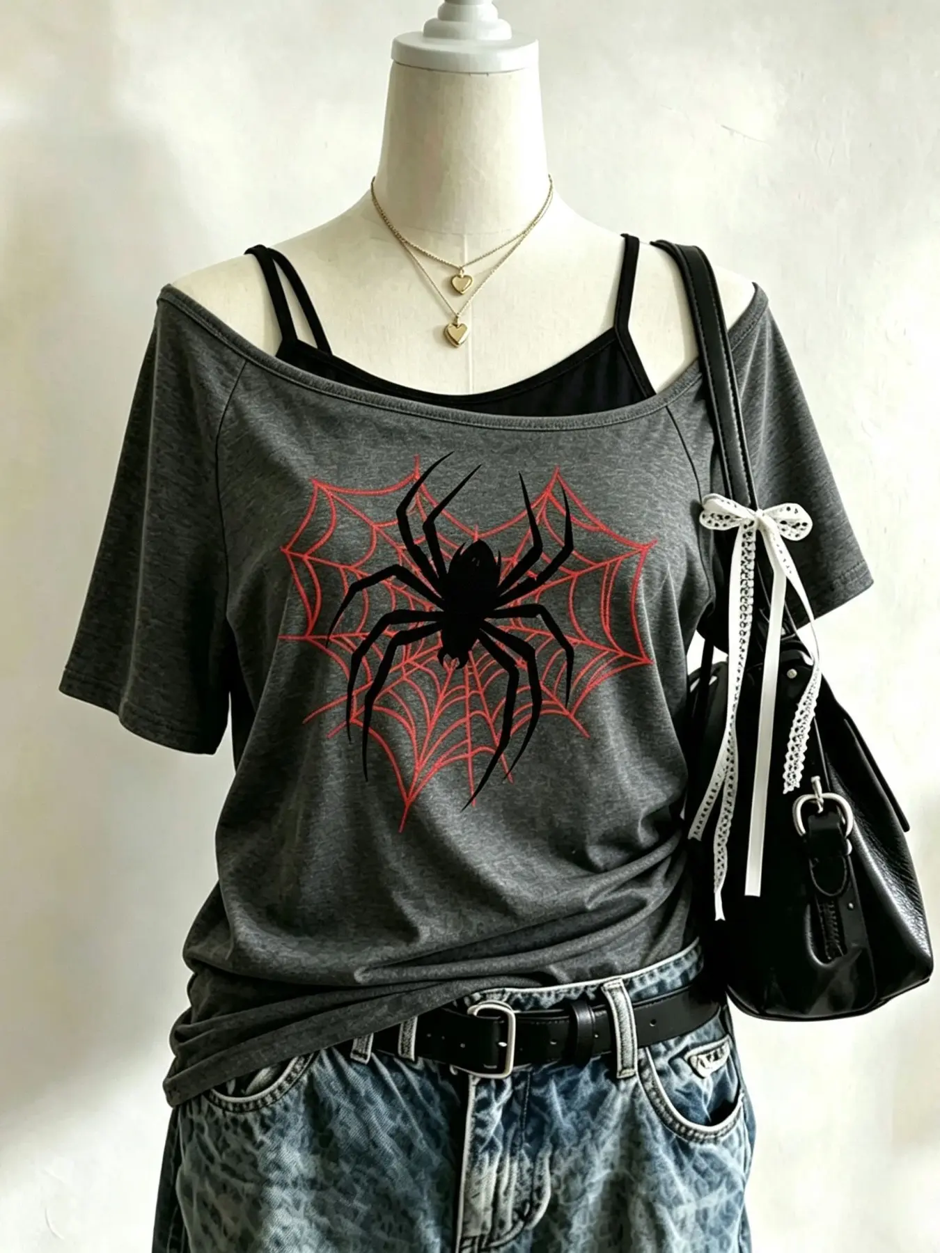Women's grey short-sleeve "faux-layered" off-shoulder T-shirt featuring a spider print; a slim-fit, casual top with Y2K/Millennial Gothic street style—perfect for daily outings, Y2K streetwear looks, and summer outfits.