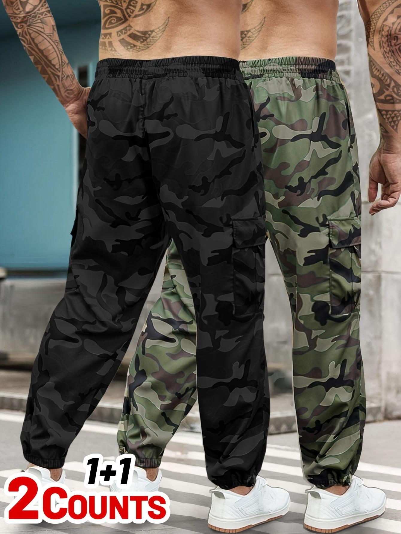 Men's 2-piece camouflage workwear, ankle tied casual pants Multi pocket drawstring elastic waist loose sports pants set Outdoor military style camouflage work pants two-piece combination Men's 2-piece camouflage workwear, ankle tied casual pants Multi pocket drawstring elastic waist loose sports pants set Outdoor military style camouflage work pants two-piece combination