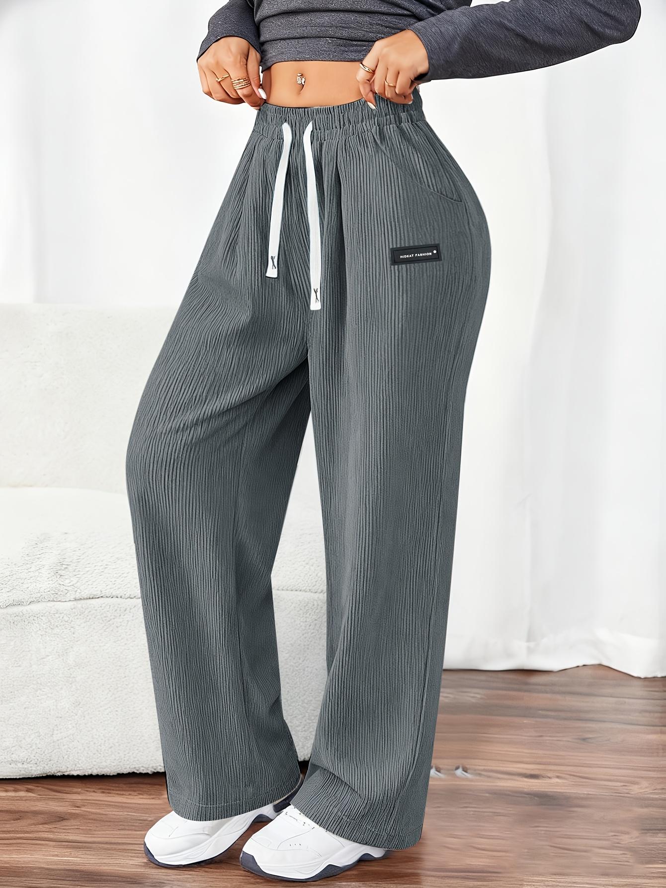 Women's Corduroy Jogger Pants for Spring and Autumn, featuring solid colors with drawstring pockets. Crafted from soft and comfortable fabric, these pants are ideal for everyday casual wear.