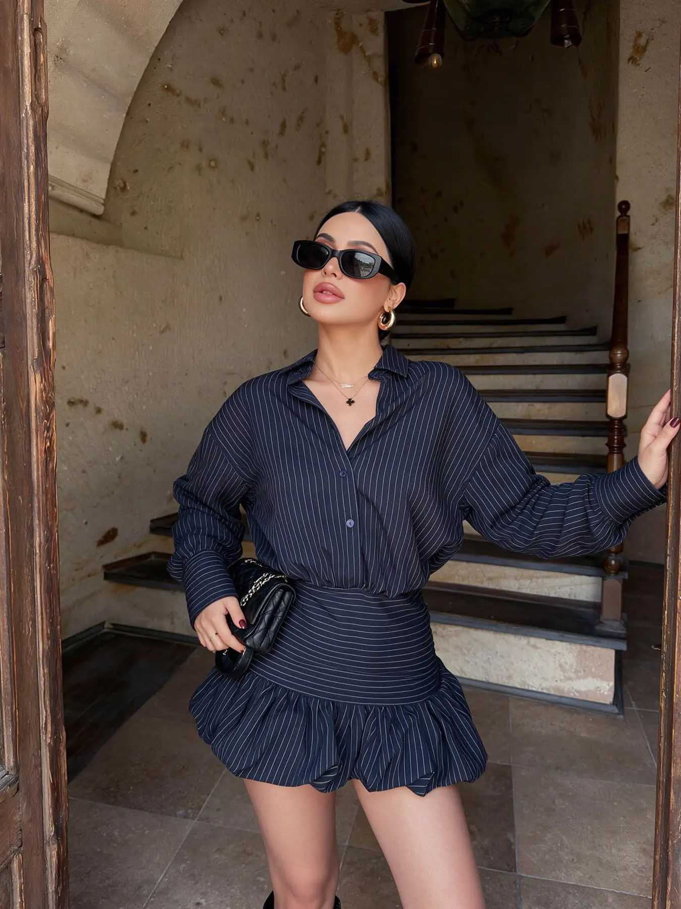 Two piece women's fashion retro solid color vertical stripe spicy girl matching clothing set with long sleeved shirt and high waisted skirt, suitable for spring and summer, suitable for bars, dates, store visits, travel photos, and holiday gatherings.