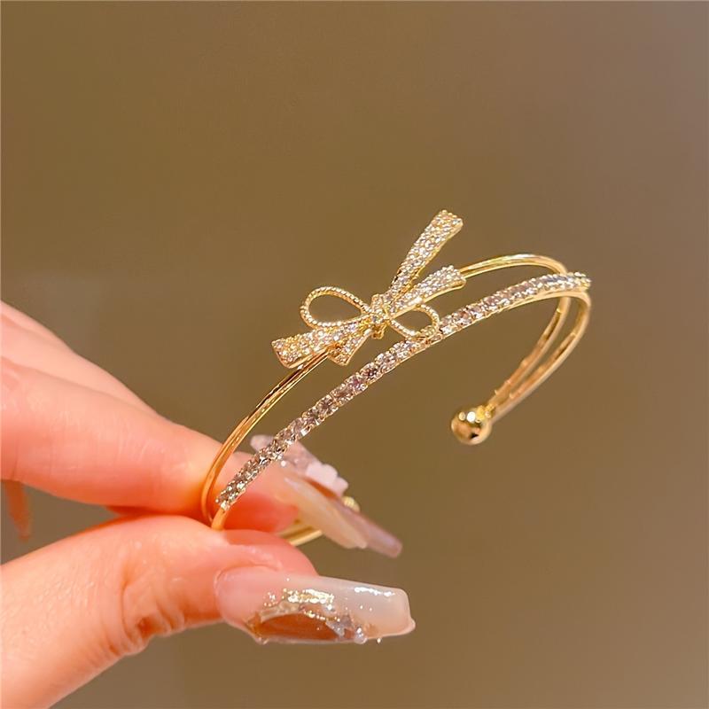 Elegant Gold Bow Bracelet with Synthetic Cubic Zirconia Inlay, Women's Open Design Bracelet for Casual and Special Occasions