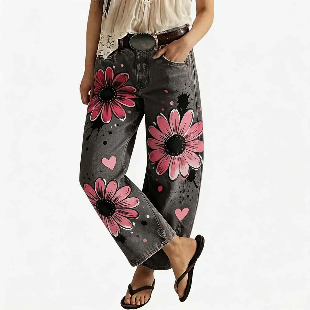 Women's vintage-wash wide-leg jeans; Y2K-style loose-fitting trousers; soft pink base with a bohemian floral print; suitable for year-round outdoor activities and streetwear styling.