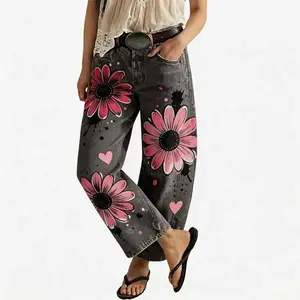 Women's vintage-wash wide-leg jeans; Y2K-style loose-fitting trousers; soft pink base with a bohemian floral print; suitable for year-round outdoor activities and streetwear styling.