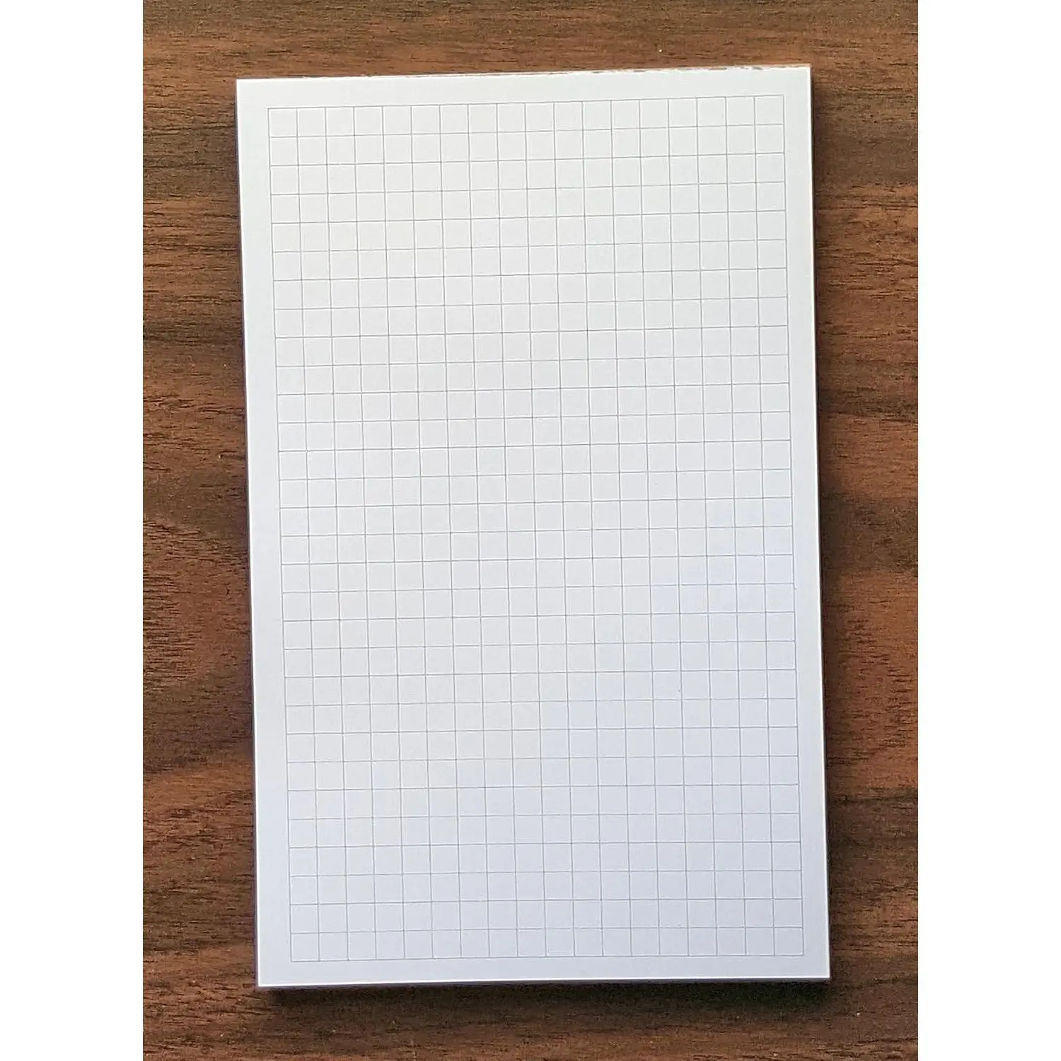 Graph Pad, 1/4” Spacing, Quantity 1, 50 Sheets, 5” x 8”. | Graph writing pads with cardboard backing and glue binding. Ink-friendly heavyweight paper. Archival quality.