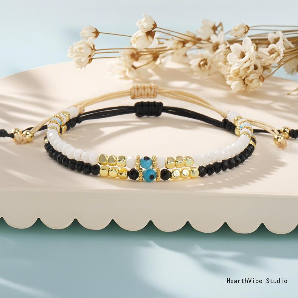 "Eye of the Demon" Couples' Bracelets: Black & White Crystal Beaded Set (2 Pieces) — Versatile, Hand-Woven Wristbands